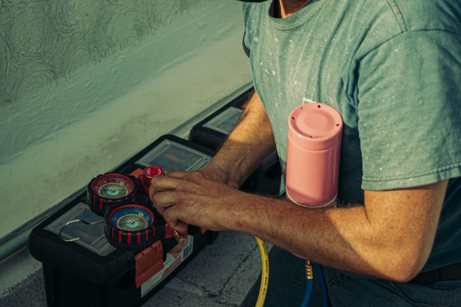 Refrigerant gauges and tools in a technician's kit
