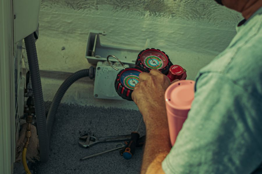 HVAC technician working on a condenser unit