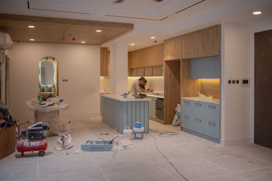 Crew installing cabinets during a kitchen remodel